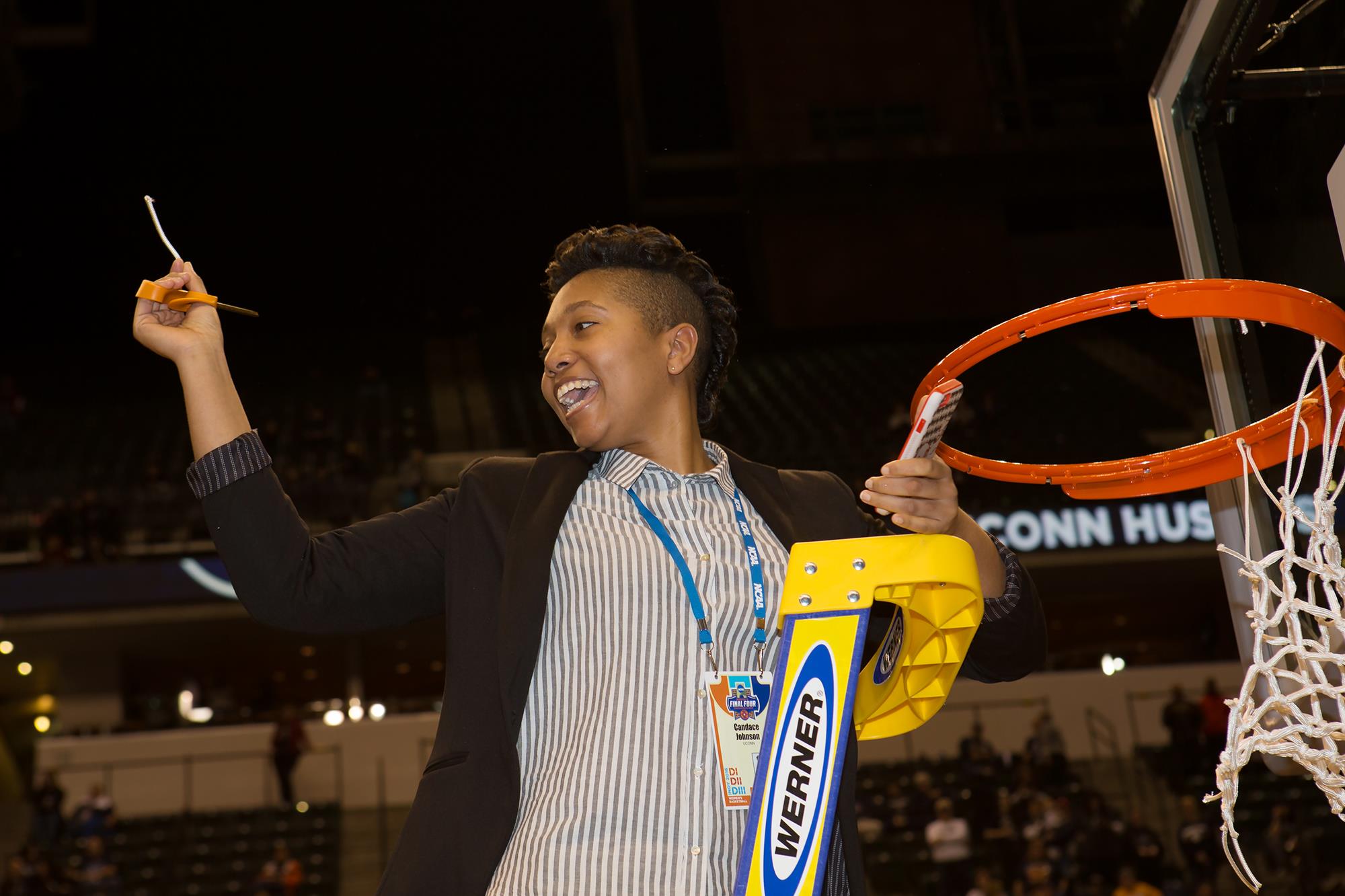 Johnson cutting down the net after UConn won the 2016 NCAA Women’s Basketball Championship. She was the secondary women’s basketball contact during the Huskies’ NCAA run.